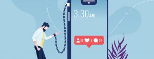 Businessman chained and shackled to a big smart phone-social networks addiction metaphor