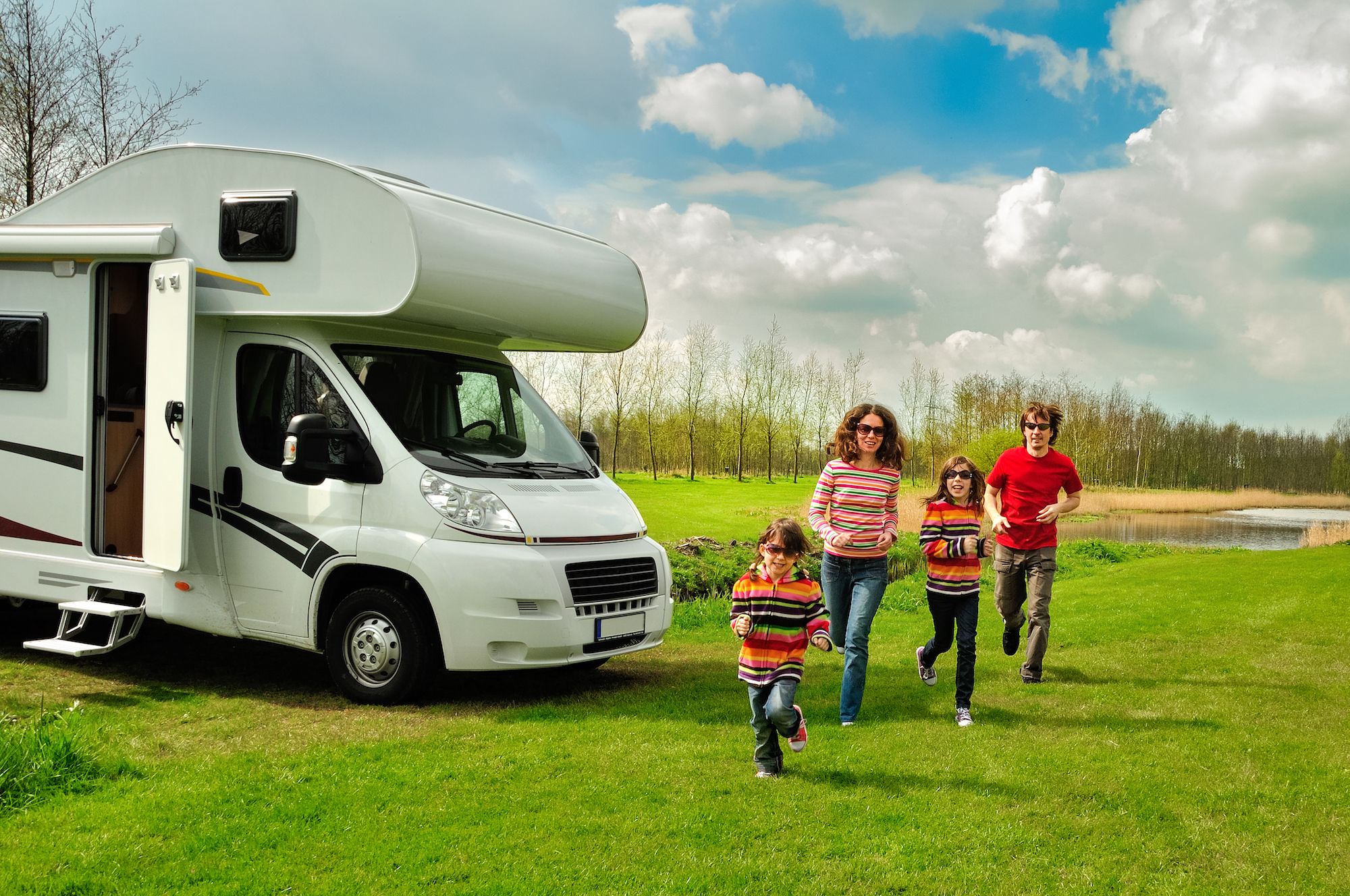 family-vacation-rv-travel-with-kids-happy-parents-with-children-have-fun-on-holiday-trip-in-motorhome.jpg